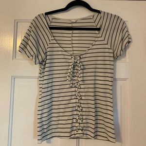 Cute white with black stripes lace up shirt.